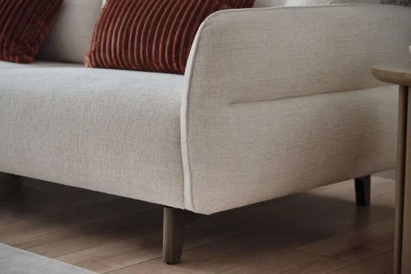 Close-up of Hera sofa set showing textured boucle fabric and elegant stitching
